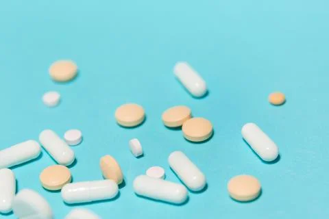 Close up. various tablets on a blue background. Stock Photos