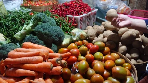 Close up of various vegetables and hand holding potato in the market Stock Footage 267567575