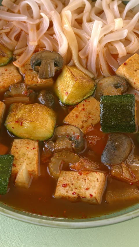 Close-up of the vegan version of kimchi soup with tofu and rice noodles. 스톡 동영상 334565170