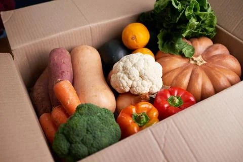 Close up of vegetable box that has just been delivered with seasonal fresh veg Stock Photos