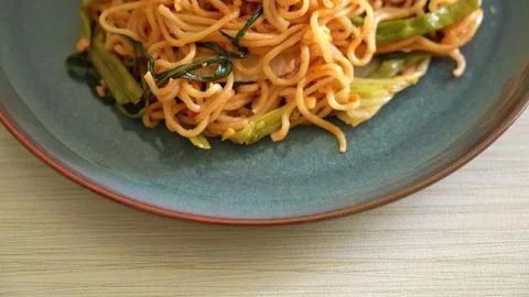 Close-up of vegetable fried noodles on a grey plate Stock Photos