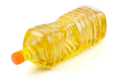 Close up vegetable or sunflower oil in plastic bottle isolated on white Stock Photos