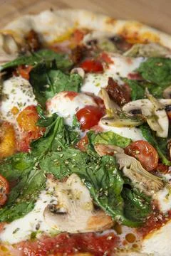 Close up of a vegetable pizza. Vertical image. Stock Photos