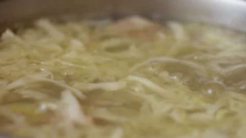 Close-Up of Vegetable Soup Boiling with Cabbage in Pot Stock-Footage 334124163