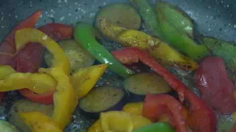 Close-Up of Vegetables Frying in Pan Video stock 310825666