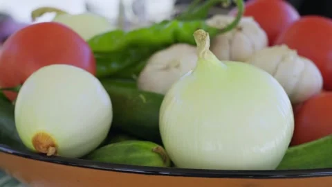 Close-up of vegetables for pilaf: onions, tomatoes, cucumbers, pepper and garlic Stock Footage 333030665