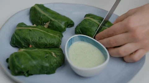 Close-up of veggie wrap with quinoa and vegetables on the blue plate Stock Footage 125293018