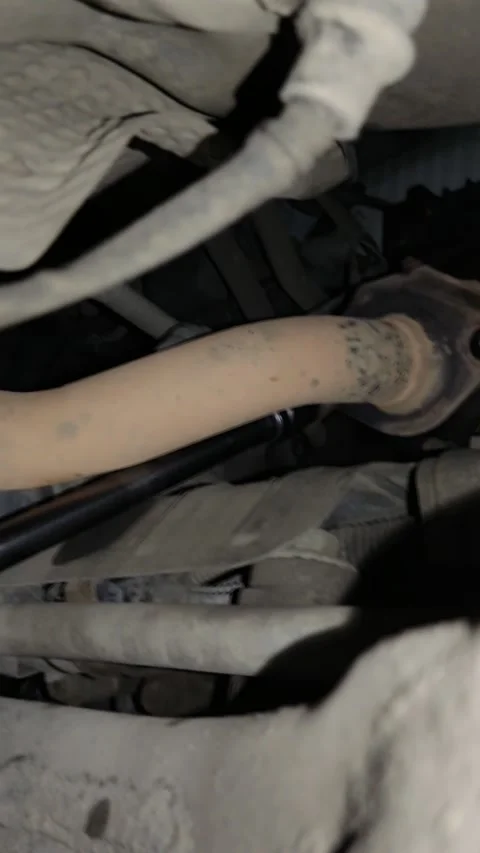 Close-up of vehicle undercarriage components including exhaust pipe Stock Footage 346638253