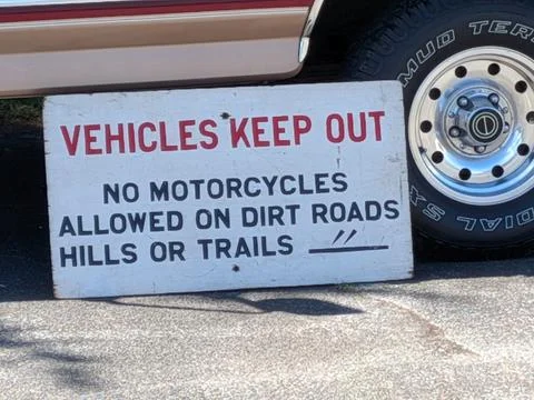 Close-up of a “Vehicles Keep Out, No Motorcycles on Dirt Roads or Trails” Photos