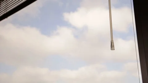 Close Up of venetian blinds dropping down slowly Stock Footage 87831531