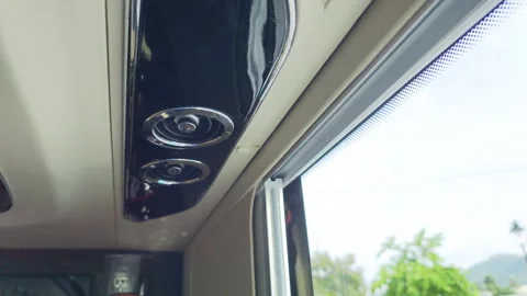Close up of a ventilation vent on the ceiling of a moving bus. Stock Footage 319417525