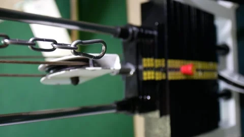 Close-up vertical 9:16 video. Stack of metal objects in the exercise machine. Stock Footage 155988963