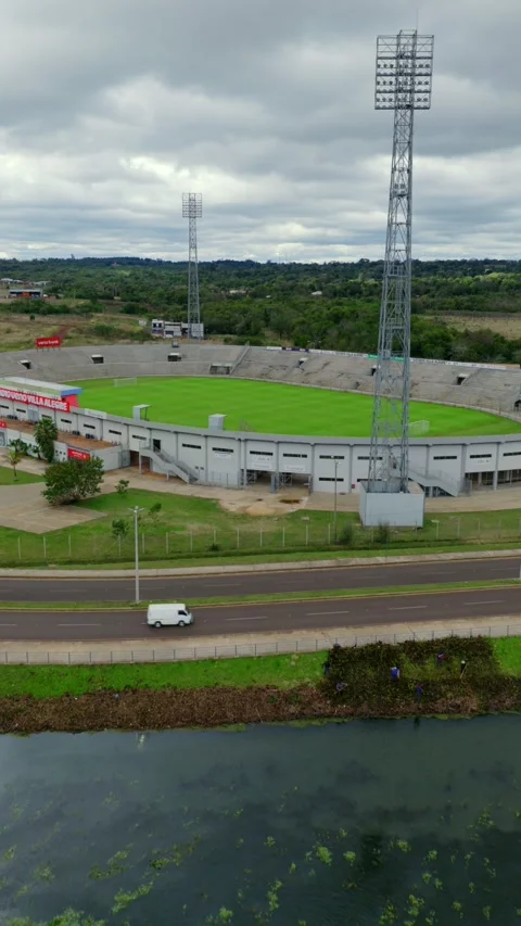 Close up vertical aerial overlooking Villa Alegre Stadium and the Parana river Video stock 333860196