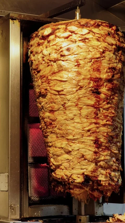 Close up of vertical grill for roasting shawarma meat. Stock Footage 324099001