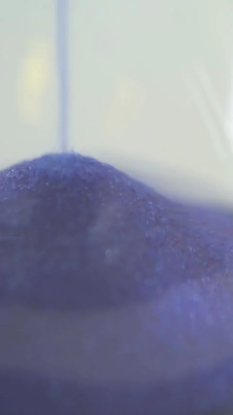 Close-Up Vertical Sand Timer with Blue Sand Representing Democratic and  Stock Footage 282665716