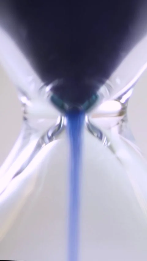Close-Up Vertical Sand Timer with Blue Sand Representing Democratic and  Stock Footage 282665817