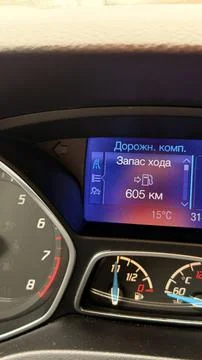 Close-up vertical shot of a modern car dashboard digital display showing the Stock Photos