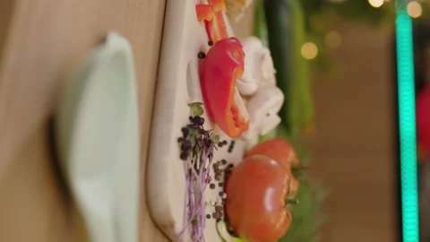 Close up vertical shot of mushrooms pepper tomato microgreen on wooden board Stock Footage 144960837