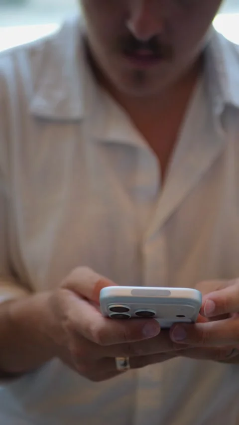 Close-Up Vertical Shot Of Person Using Smartphone Indoors... Vídeo Stock 334437390
