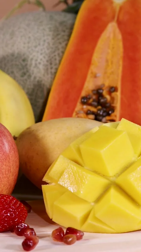 Close Up Vertical Shot of Sliced Papaya and Mango Arrangement Stock Footage 326401779