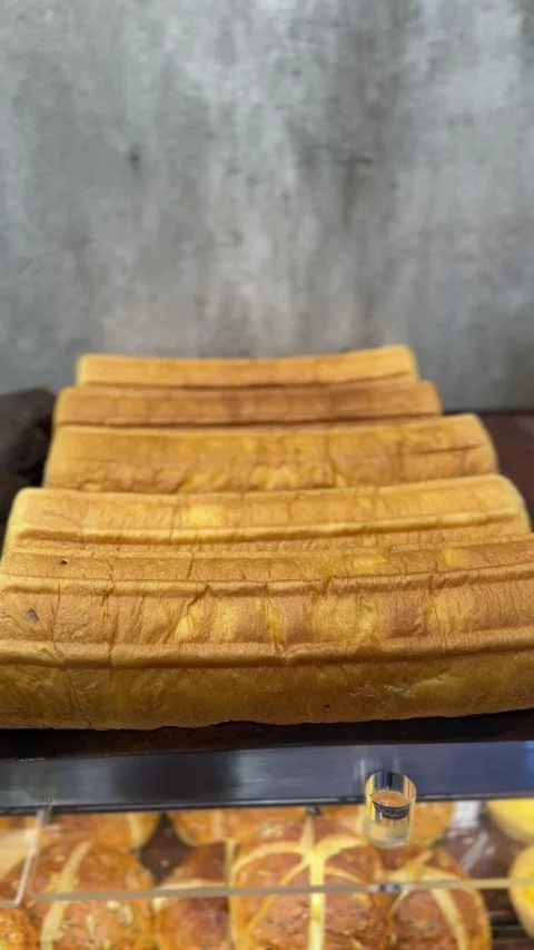 Close-up vertical video of bread roll texture with golden crust Stock Footage 322967505