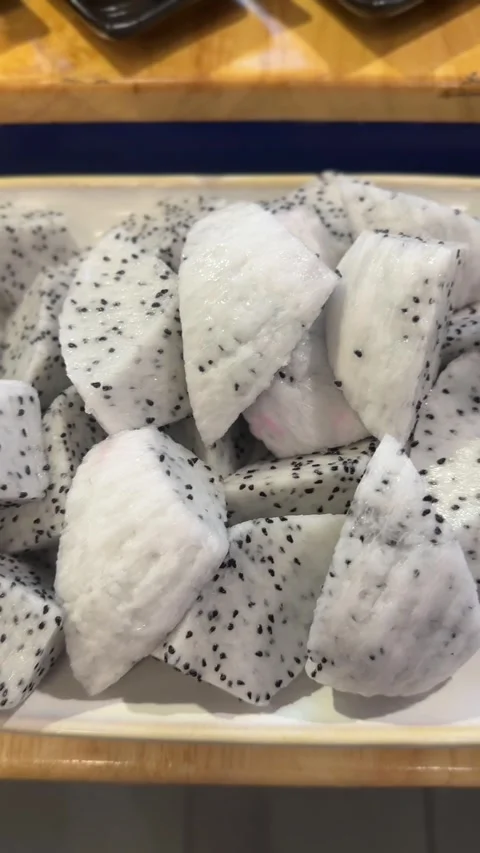 Close-up vertical video of chopped dragonfruit pieces Stock Footage 322967534