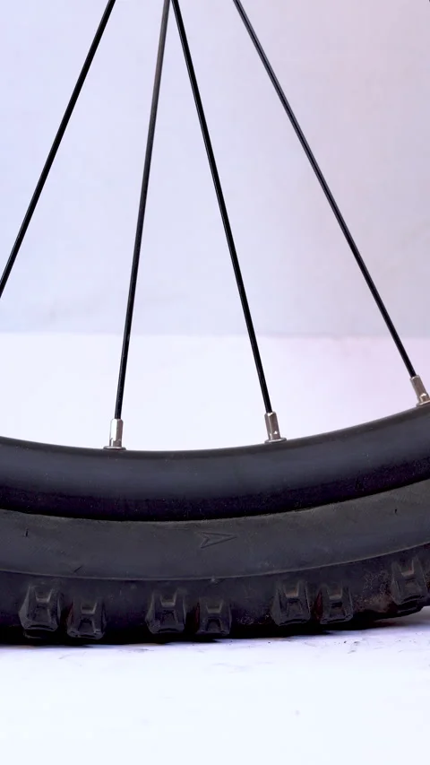 Close-up vertical video of a flat bicycle tire being inflated, focusing on .. Stock Footage 310259026
