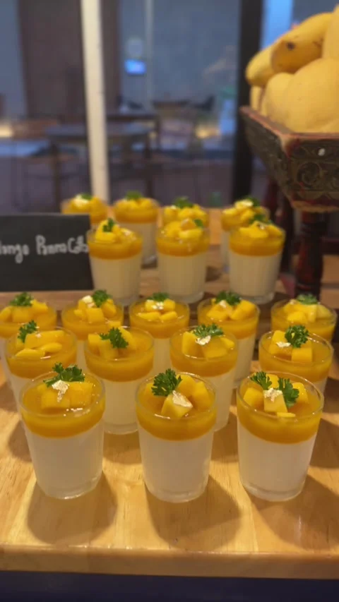 Close-up vertical video of mango panna cotta cups Stock Footage 322967610