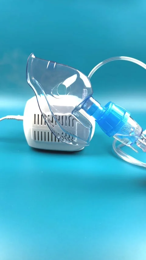 Close-up of a vertical video, a mask for inhalation, from which the vapors are Stock Footage 318443977