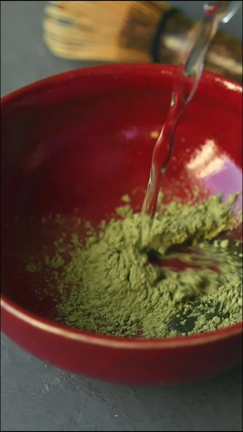 Close-up vertical video of the matcha green tea making process. Video stock 287297434
