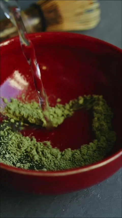Close-up vertical video of the matcha green tea making process. Video stock 287297438