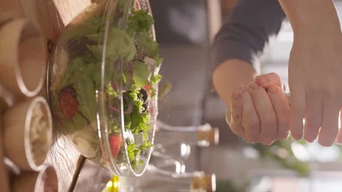 Close-Up vertical video of a Mediterranean Salad with Fresh Vegetables as Stock Footage 293756218