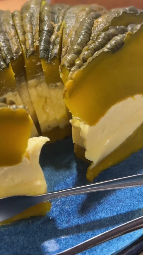 Close-up vertical video of pumpkin custard dessert with creamy filling inside Stock Footage 322967728