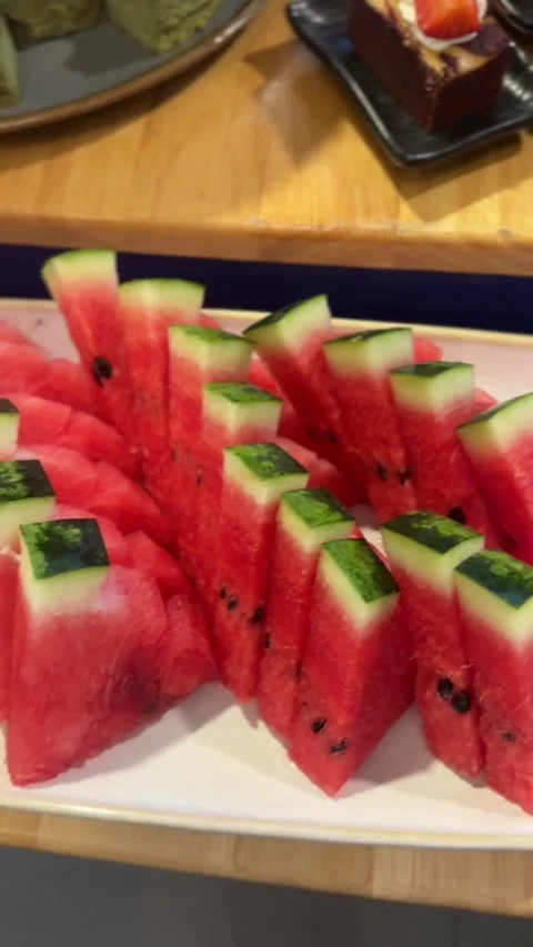 Close-up vertical video of sliced watermelon wedges Stock Footage 322967700