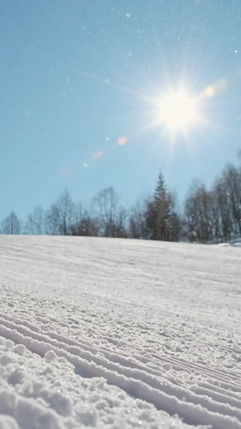Close up vertical view freshly groomed ski slope with textured snow surface.. Stock Footage 311814792