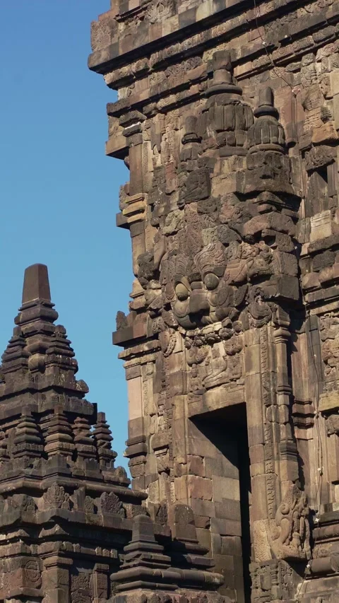 Close vertical view highlights a richly carved Prambanan Temple facade, sac.. Stock Footage 341547972