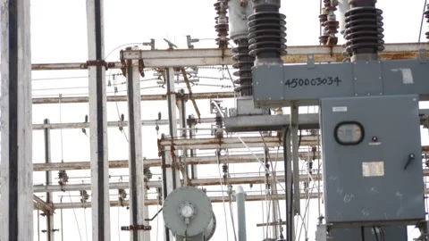 Close vertical view of insulators attached over transformer Stock Footage 147859116