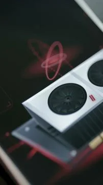 Close vertical view shows a white dual fan graphics card Stock Photos