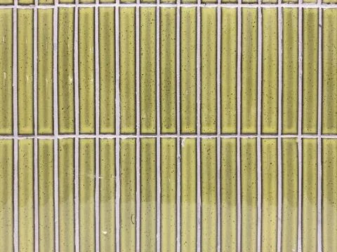 Close-up of vertically arranged rectangular green tiles 写真素材