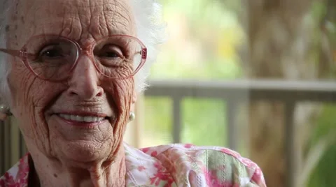 Close Up of very old lady looking at camera with different funny expressioms Stock Footage 45522260