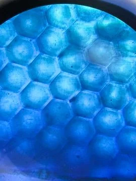 Close-up of vibrant blue hexagonal pattern resembling a honeycomb structure.. Stock Photos