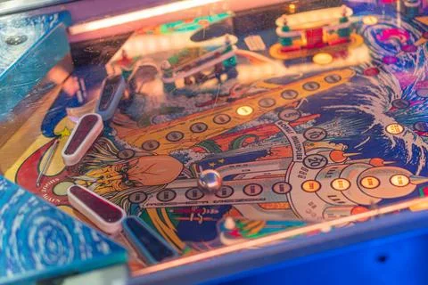 Close-up of vibrant, blue-orange ping pong slot machine with colorful symbo.. Stock Photos