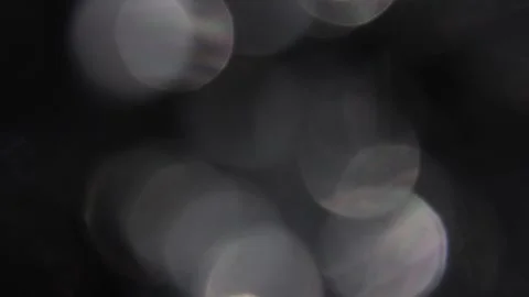 Close-up of vibrant bokeh with delicate flames of white lights 스톡 동영상 317455621