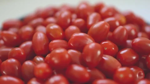 Close-up of vibrant, fresh red grape tomatoes grouped together Stock Footage 296324060