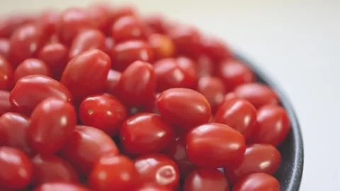 Close-up of vibrant, fresh red grape tomatoes grouped together Stock Footage 296324570