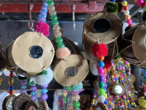 Close-Up: Vibrant Pakistani Decorative Strings with Miniature Dholaks &amp; Mirro Stock Photos