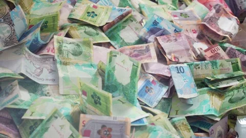 Close up vibrant pile of Qatari Riyal banknotes from the fifth series. Vari.. Stock Footage 341267501