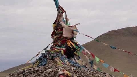 Close Up Vibrant Prayer Flags Blowing in the Wind Near Sacred Ovoo Cairn Video stock 348046982