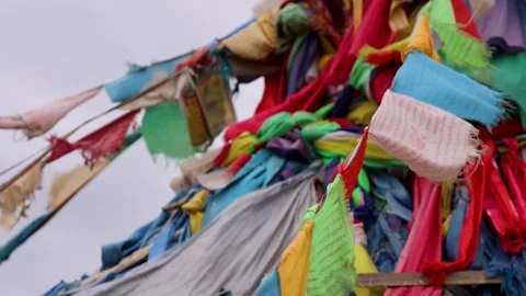 Close Up Vibrant Prayer Flags Blowing in the Wind Near Sacred Ovoo Cairn 動画素材 348047180