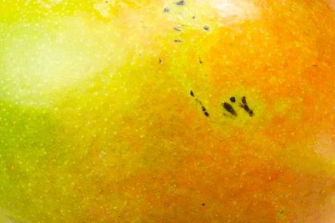 Close-up of vibrant tropical mango fruit surface Stock Photos
